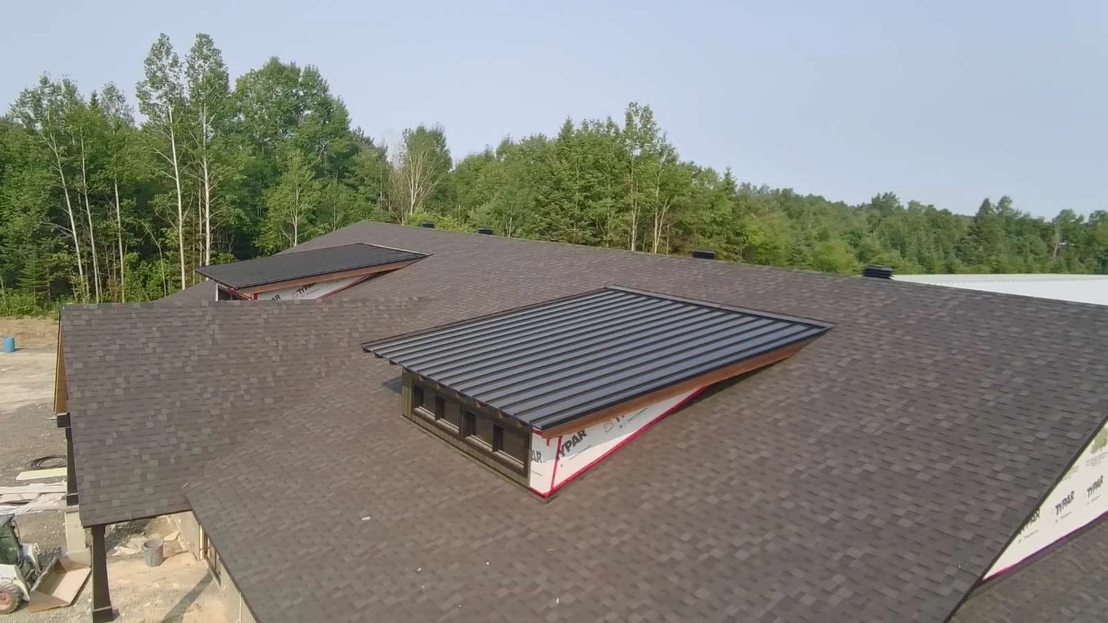 Angled view of a metal-clad dormer roof