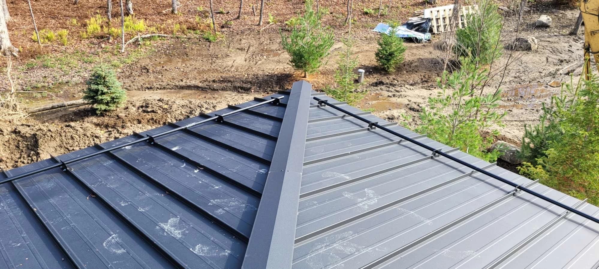 Close view of a standing seam roof hip