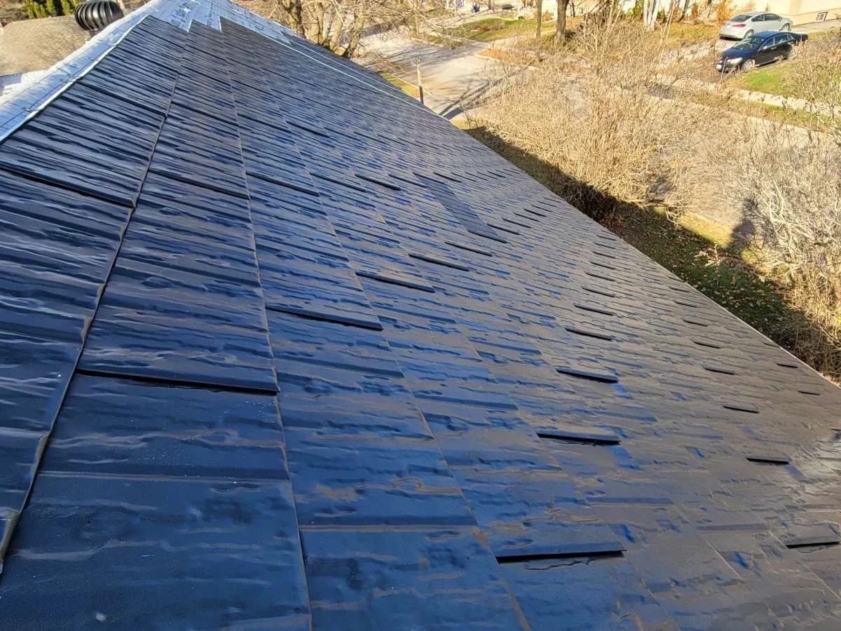 Metal shingle roof viewed along its slope