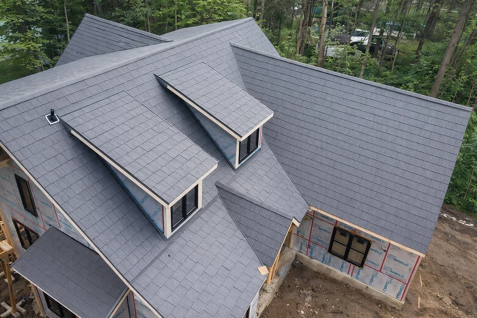 Aerial view of a metal shingle roof with dormers