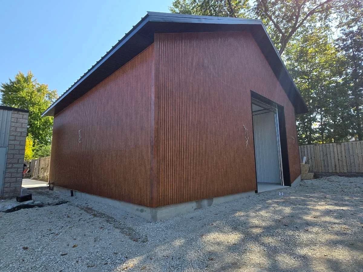 Side view of wood-look metal siding on a detached garage